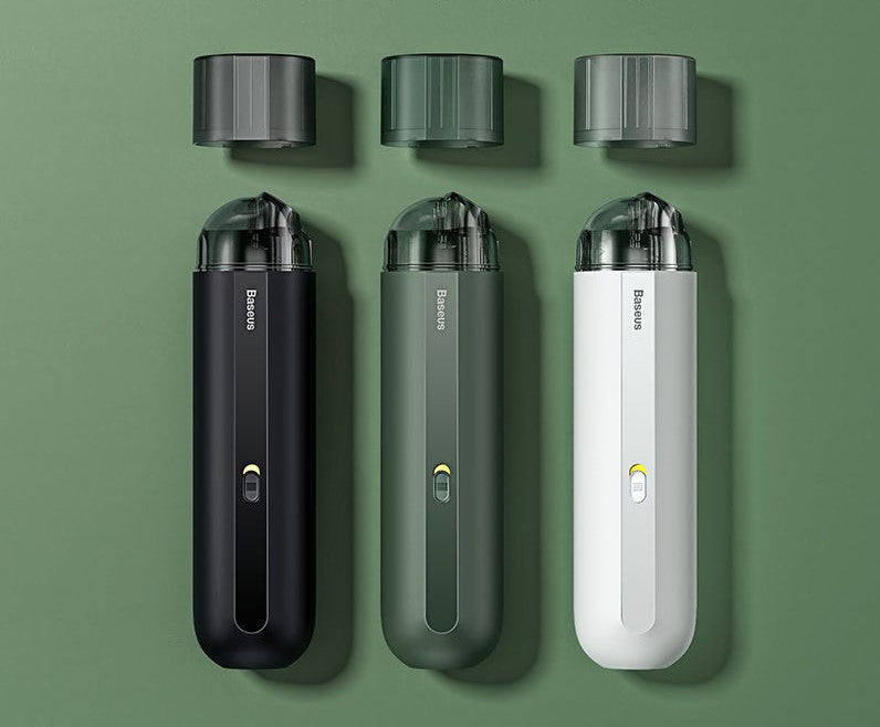Three electronic devices with different color options on a green background